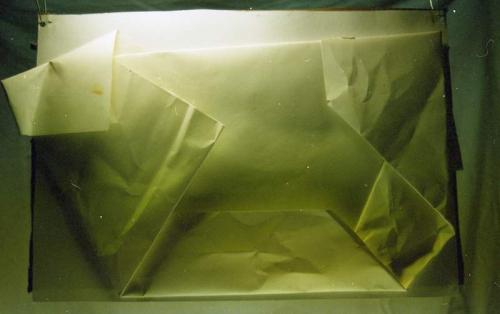 folded paper stuck on cardboard